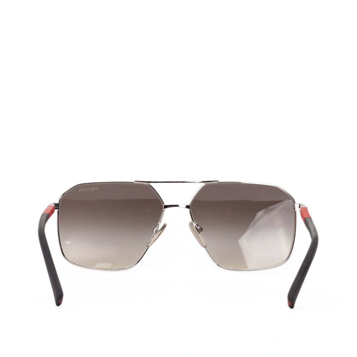 Prada Linea Rossa sunglasses with silver metal frame and gradient lenses, curated Pre-loved Luxury by Myluxe in Helsinki.