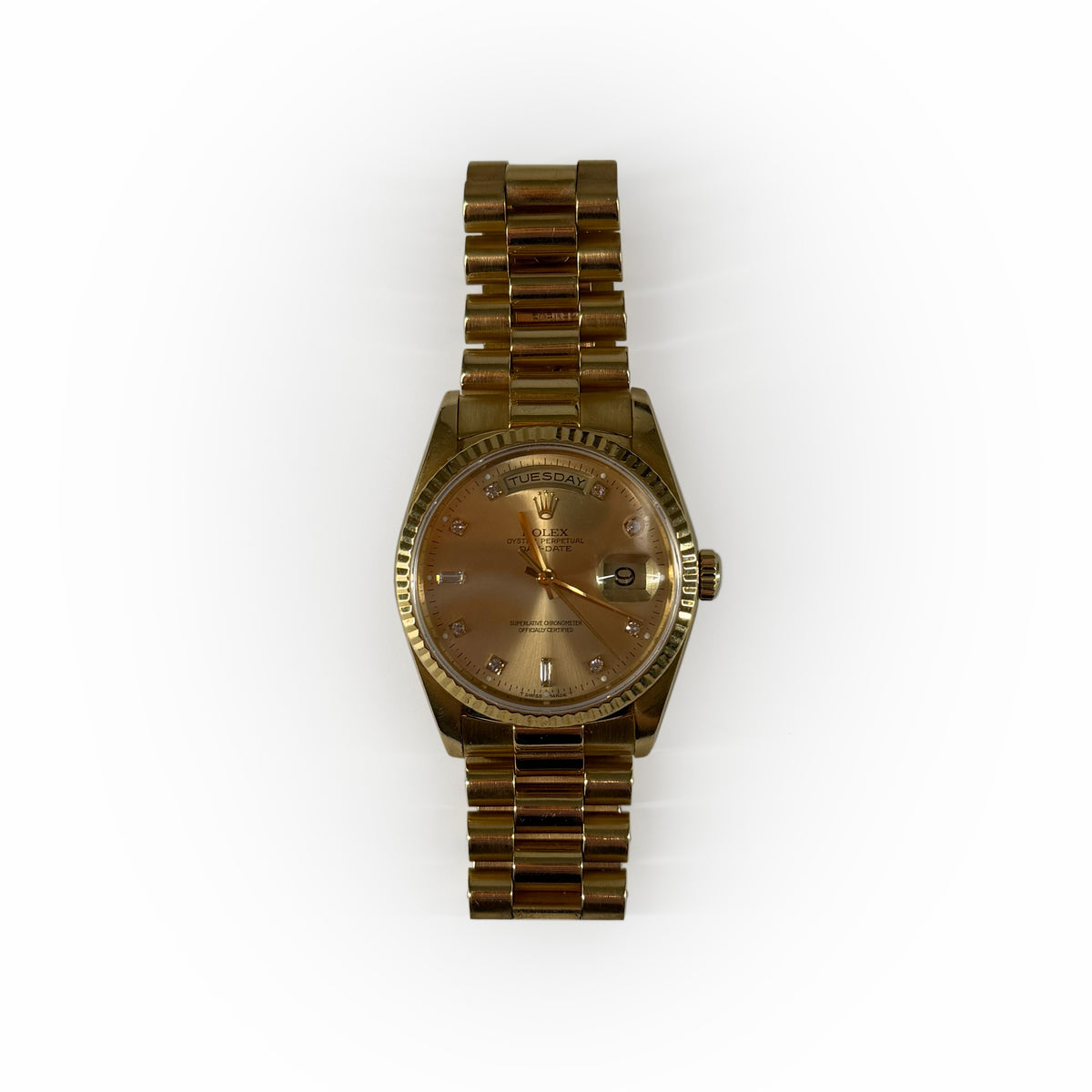 Gold Rolex Oyster Perpetual Day-Date watch with champagne dial, curated Pre-loved Luxury by Myluxe in Helsinki.