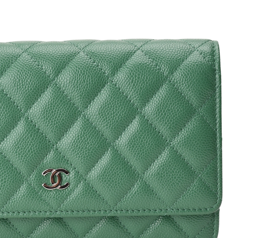Green quilted caviar leather Chanel wallet. Curated Pre-loved Luxury by Myluxe in Helsinki.