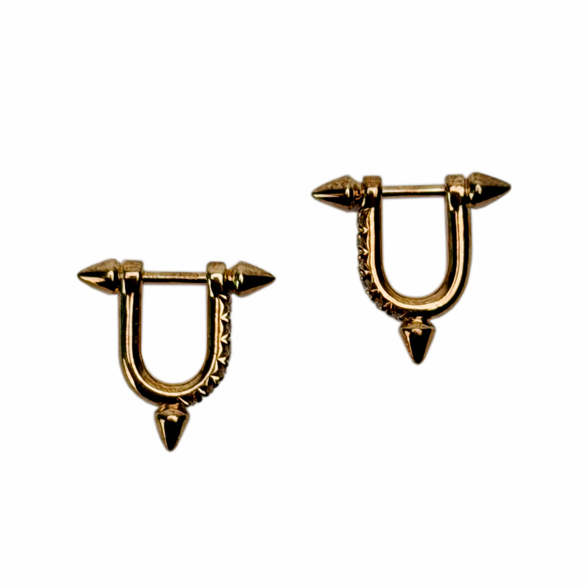 Gold-toned spiked hoop earrings with textured details, curated Pre-loved Luxury by Myluxe in Helsinki.