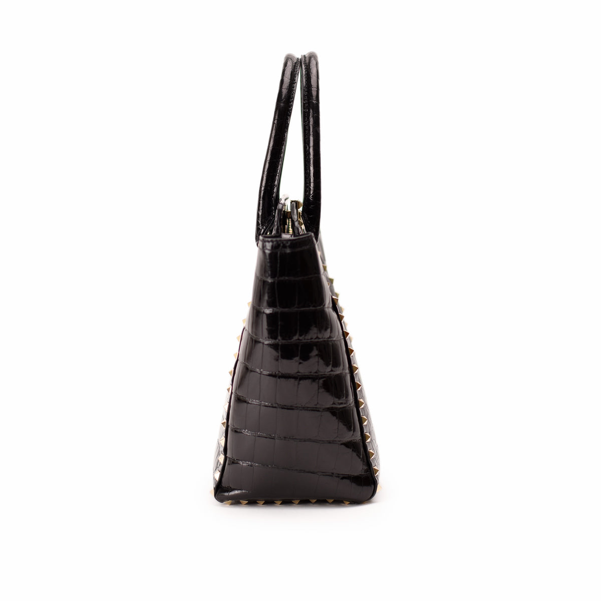 Black crocodile embossed leather handbag with gold studs, curated Pre-loved Luxury by Myluxe in Helsinki.