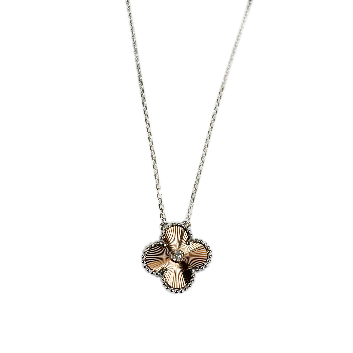 Gold and silver clover pendant necklace with central diamond, curated Pre-loved Luxury by Myluxe in Helsinki.