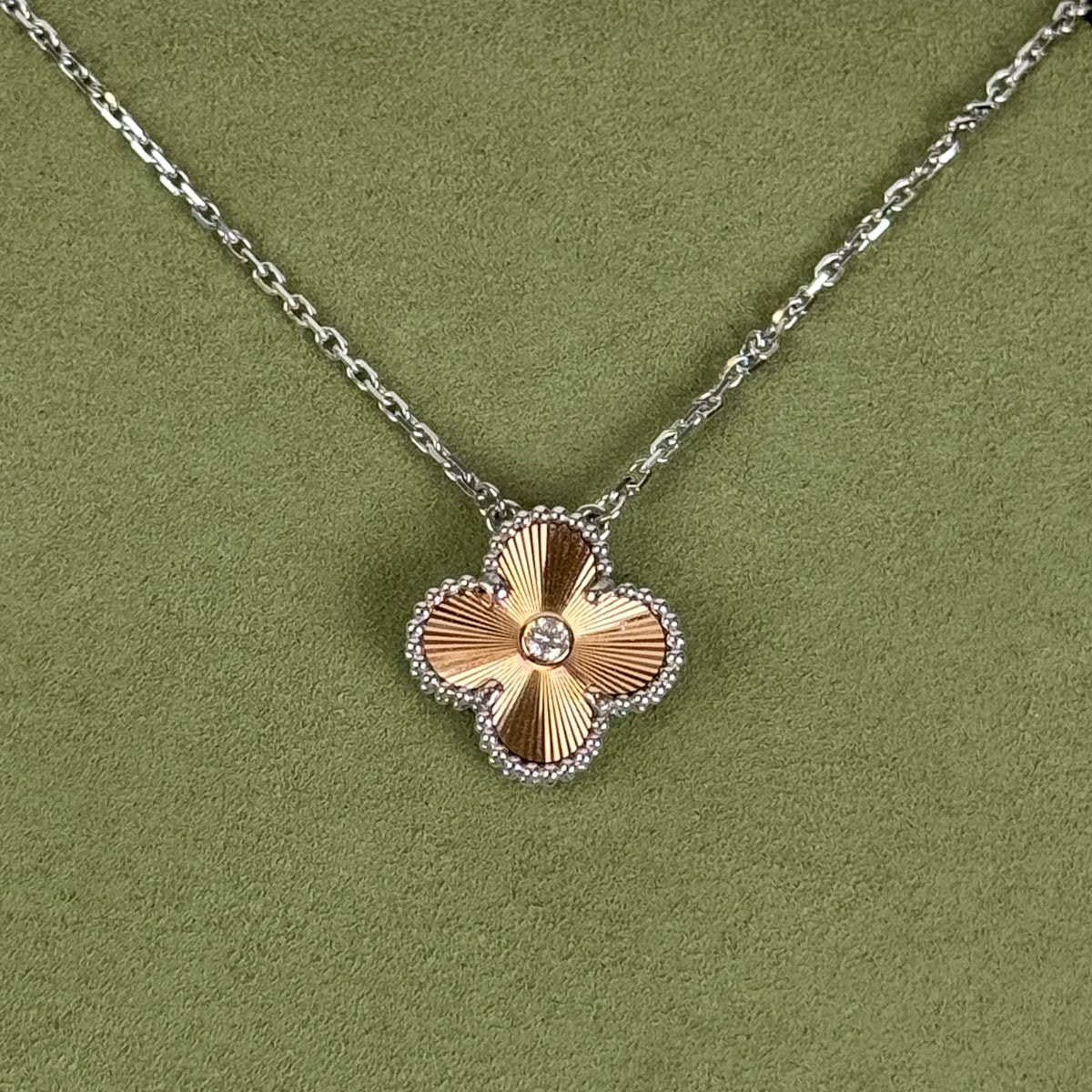 Gold-toned four-leaf clover pendant necklace with diamond accents, curated Pre-loved Luxury by Myluxe in Helsinki.