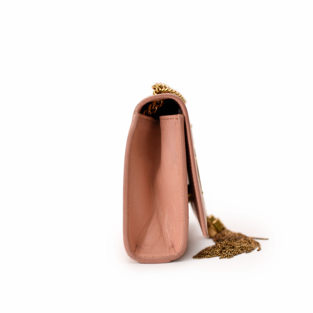 Side view of a pink leather luxury handbag with gold chain and tassel, curated Pre-loved Luxury by Myluxe in Helsinki.