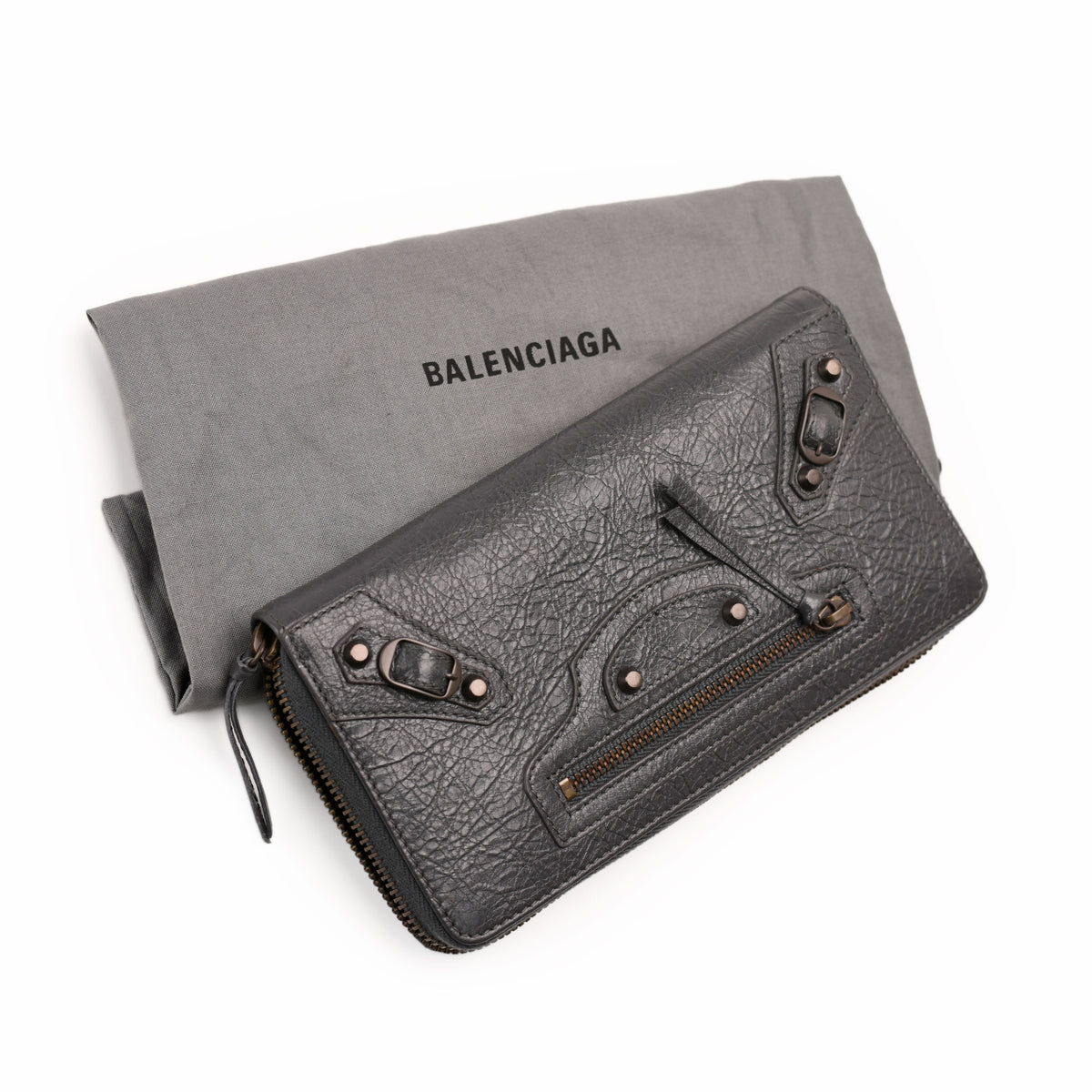 Black grained leather Balenciaga zip-around wallet with buckle details, curated Pre-loved Luxury by Myluxe in Helsinki.