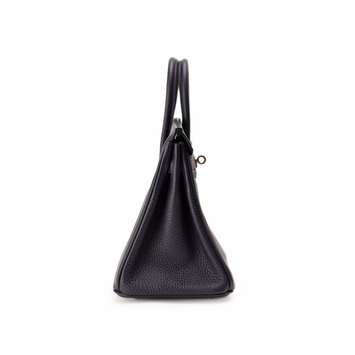 Side view of a black pebbled leather designer handbag with top handles. curated Pre-loved Luxury by Myluxe in Helsinki.