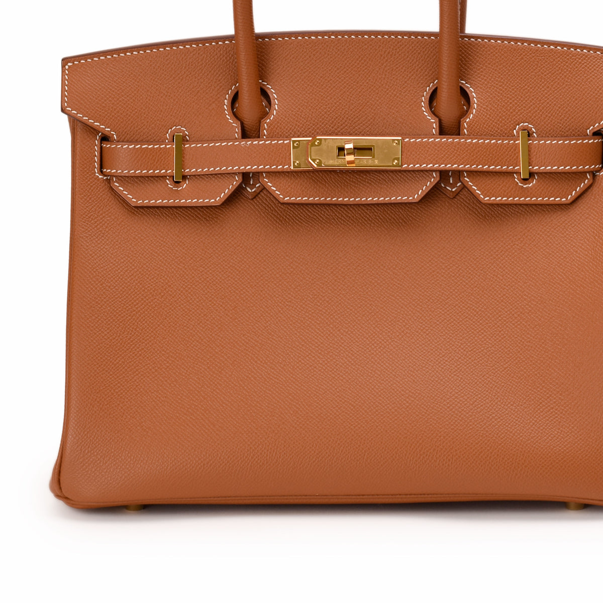 Hermès tan leather handbag with gold-tone hardware. curated Pre-loved Luxury by Myluxe in Helsinki.
