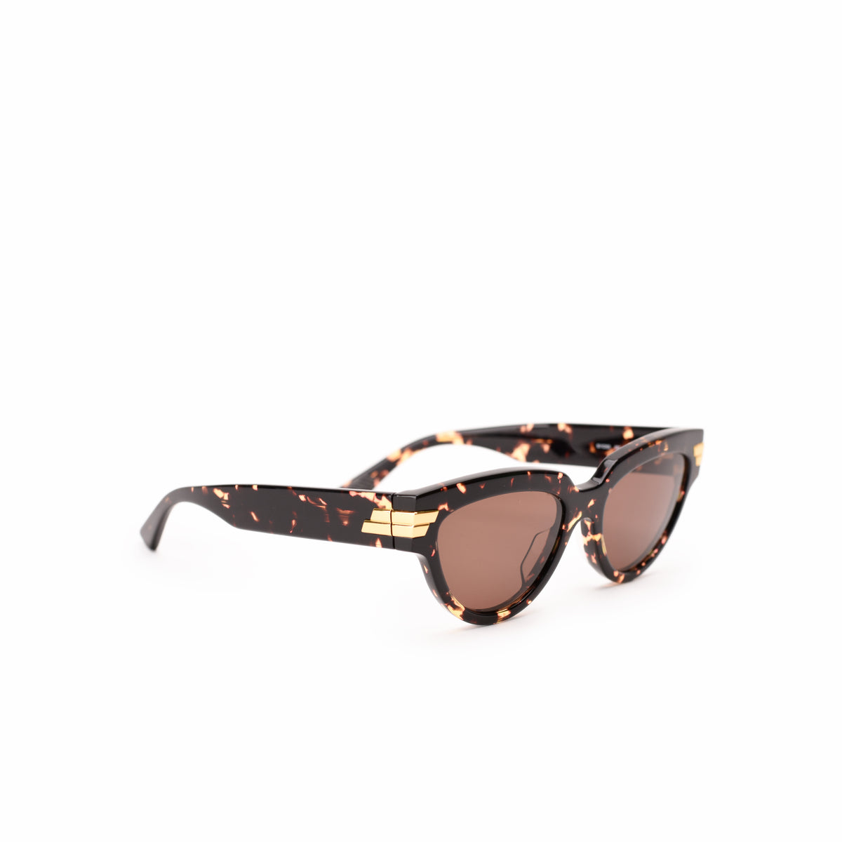 Tortoiseshell sunglasses with gold-tone accents and brown lenses. curated Pre-loved Luxury by Myluxe in Helsinki.