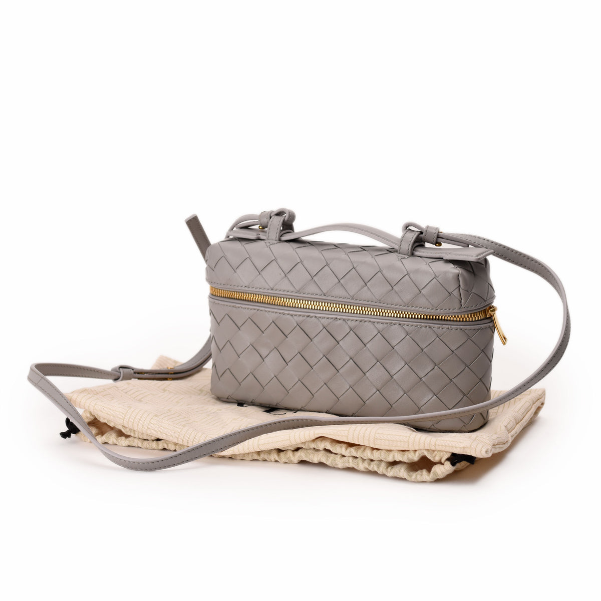 Grey Bottega Veneta Intrecciato woven leather crossbody bag with gold hardware. curated Pre-loved Luxury by Myluxe in Helsinki.