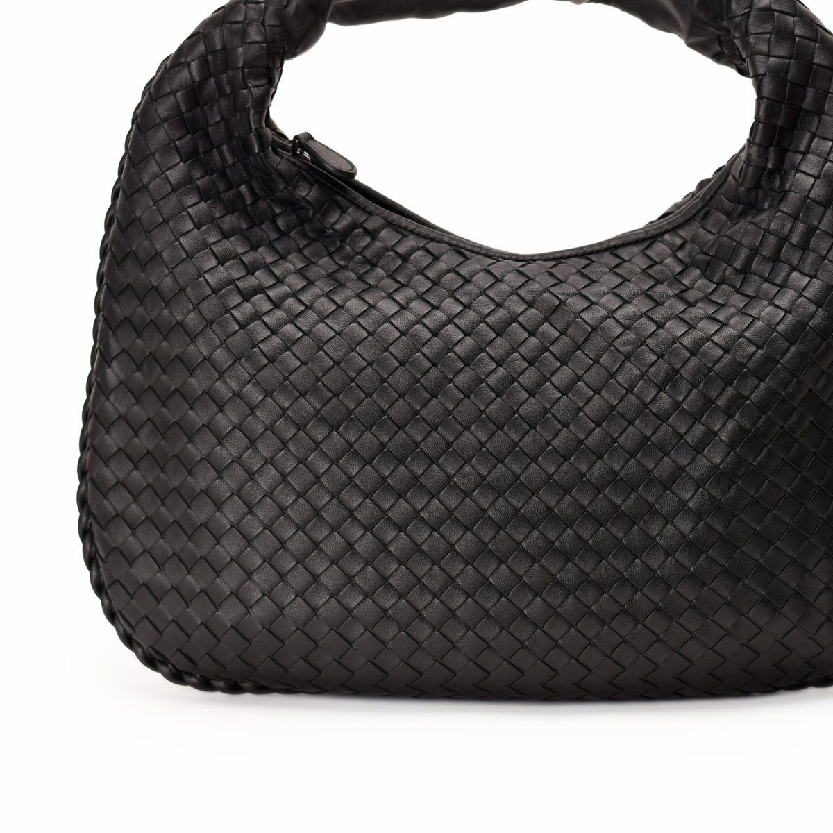 Black woven leather Bottega Veneta handbag, curated Pre-loved Luxury by Myluxe in Helsinki.