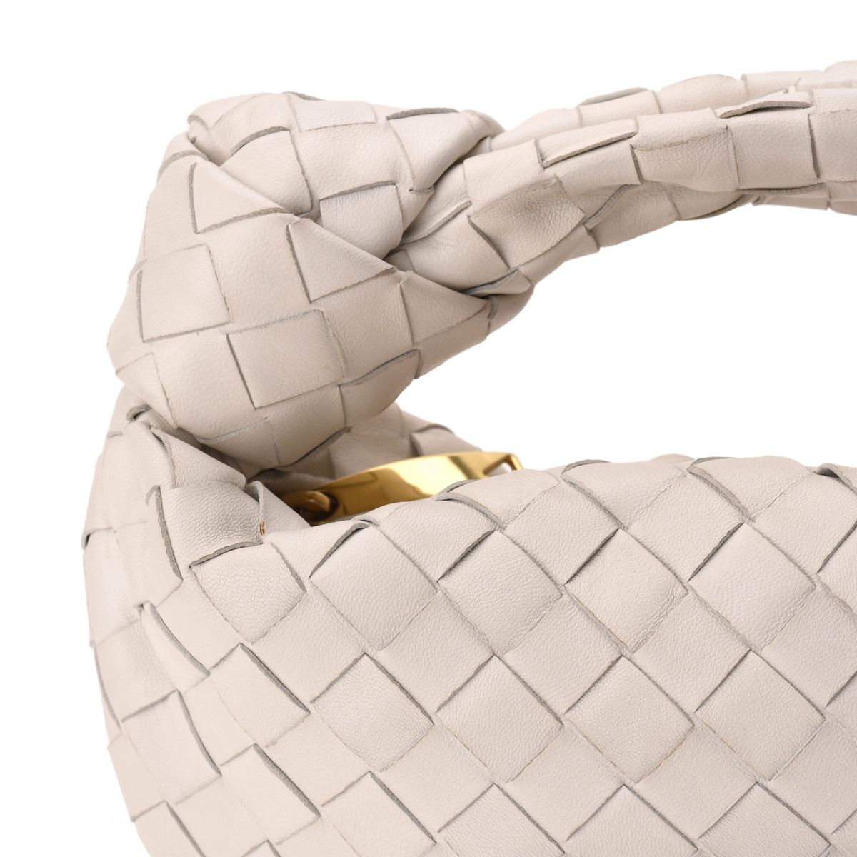 White woven leather Bottega Veneta handbag with gold hardware. Curated Pre-loved Luxury by Myluxe in Helsinki.