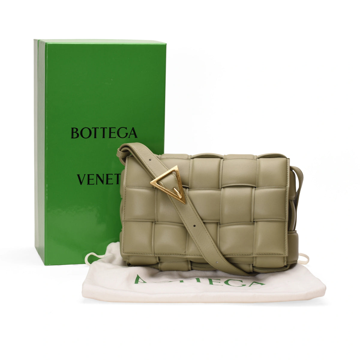 Bottega Veneta padded Cassette bag in sage lambskin, featuring a sleek design and signature woven leather detailing.