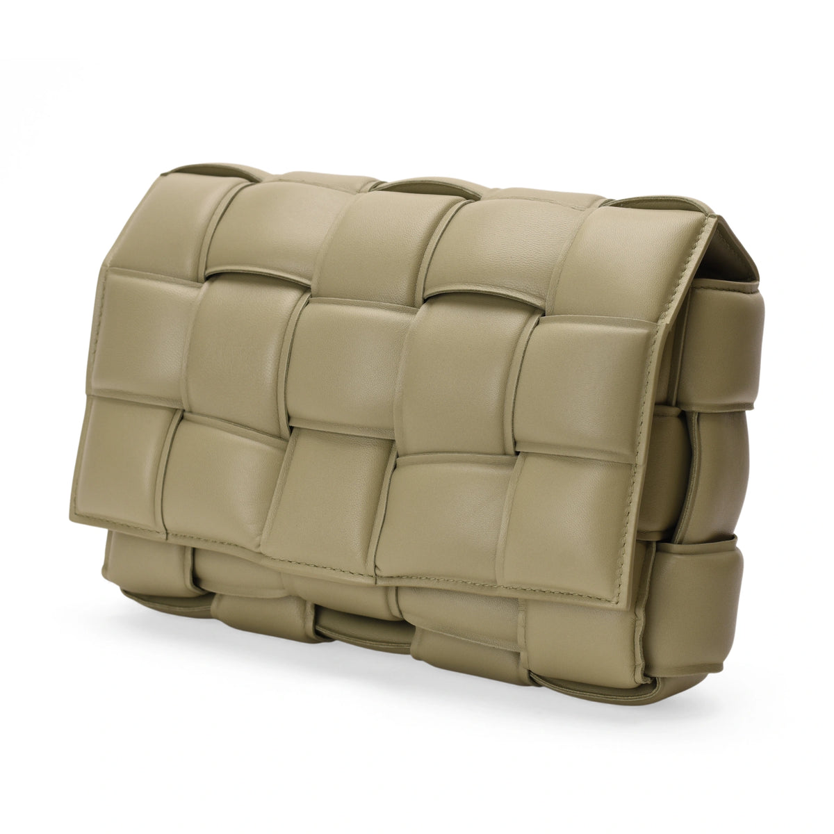 Bottega Veneta padded Cassette bag in sage lambskin featuring signature woven leather details and a modern rectangular silhouette.