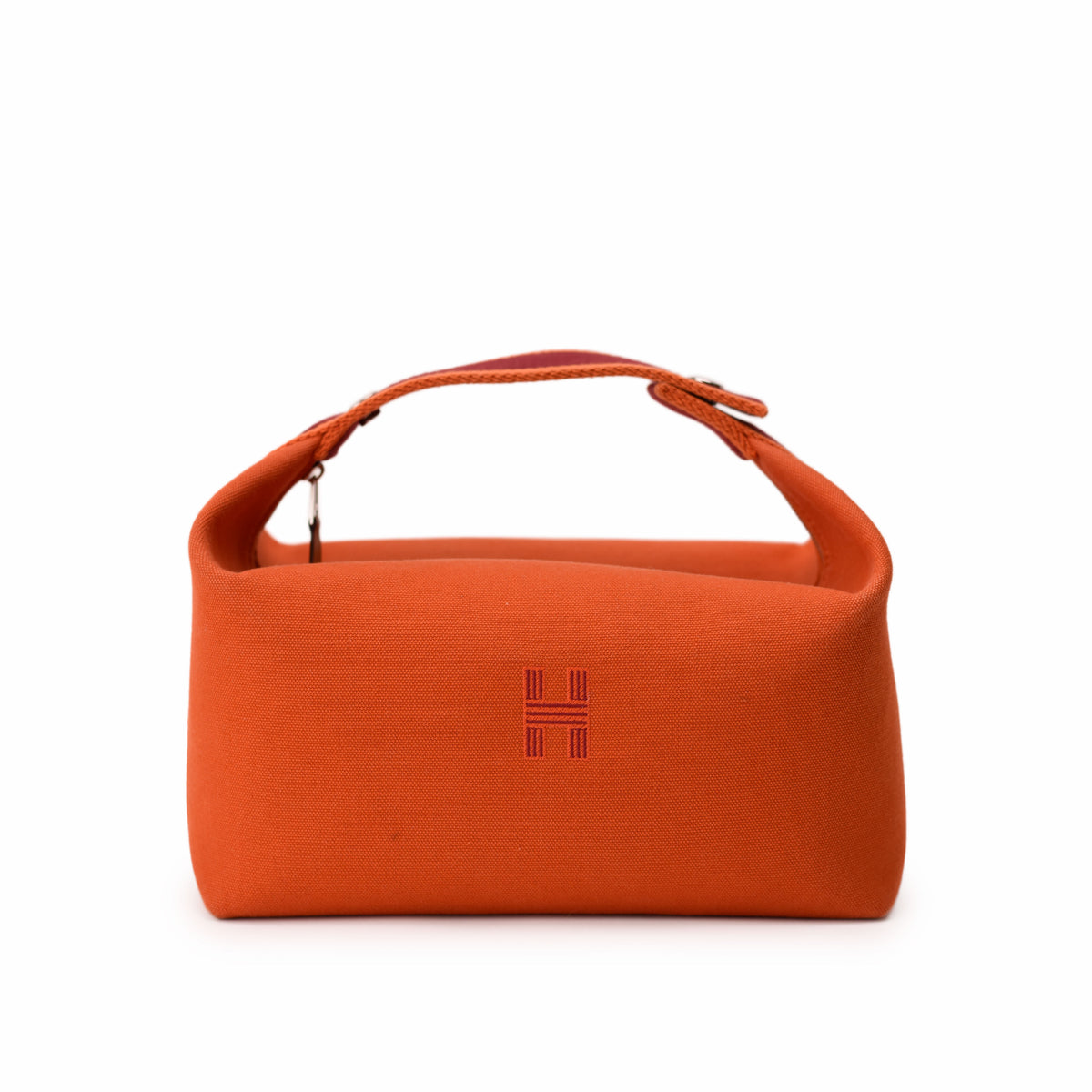Orange Hermès canvas handbag with top handle. curated Pre-loved Luxury by Myluxe in Helsinki.