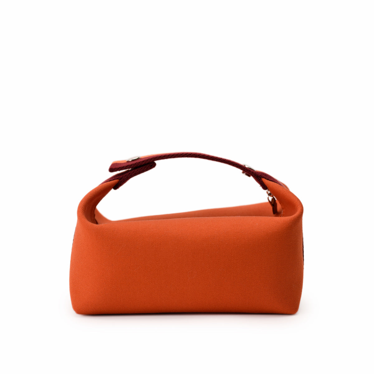 Orange canvas luxury handbag with a structured top handle. curated Pre-loved Luxury by Myluxe in Helsinki.