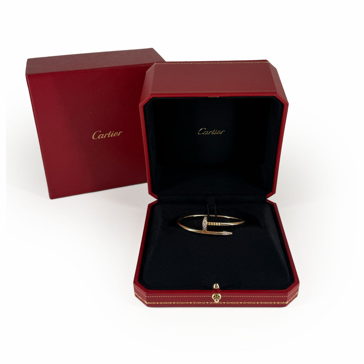 Cartier gold Trinity bangle in a red signature box, curated Pre-loved Luxury by Myluxe in Helsinki.