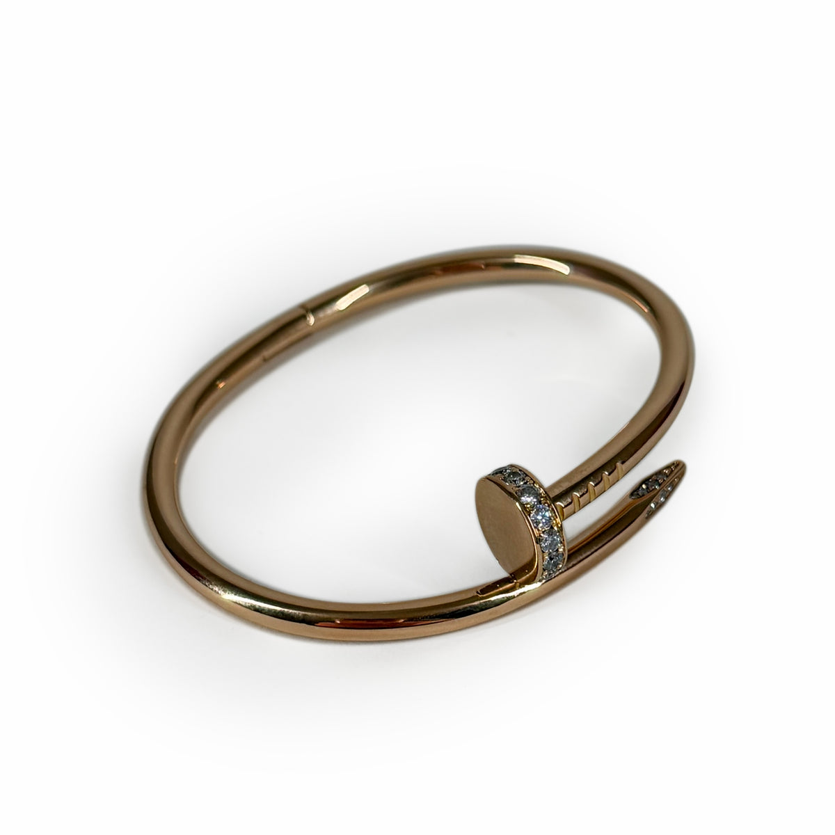 Gold-tone nail-shaped bangle bracelet with crystal embellishments, curated Pre-loved Luxury by Myluxe in Helsinki.