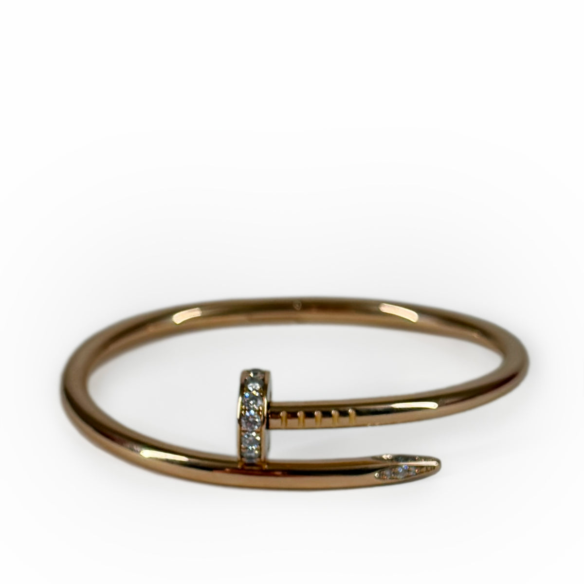 Rose gold nail-shaped bangle adorned with diamonds, curated Pre-loved Luxury by Myluxe in Helsinki.