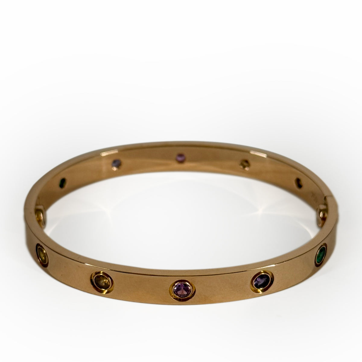 Gold-tone bangle bracelet featuring inlaid multi-colored gemstones, curated Pre-loved Luxury by Myluxe in Helsinki.