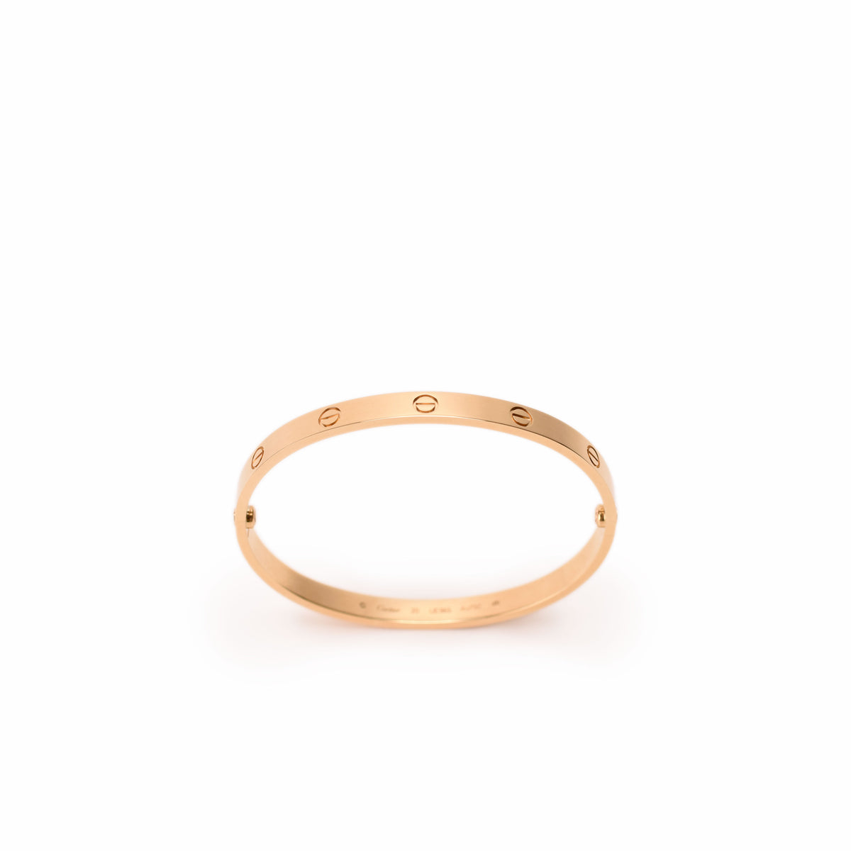 Cartier Love bracelet in yellow gold featuring signature screw motifs and sleek, polished jewelry design.