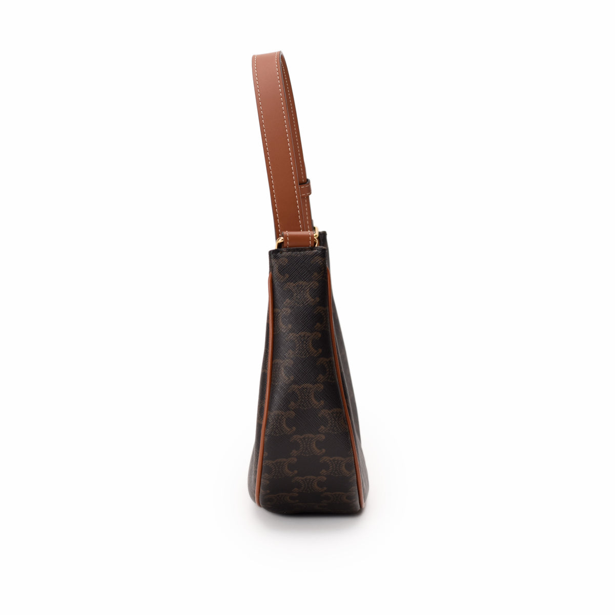 Side view of a brown monogram Goyard handbag with tan leather handle, curated Pre-loved Luxury by Myluxe in Helsinki.