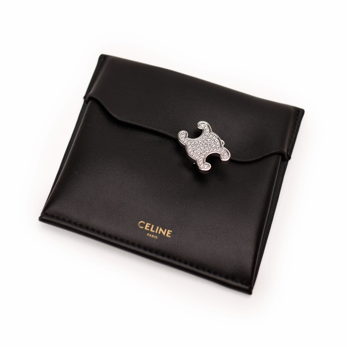 Black leather Celine wallet with crystal-embellished clasp, curated Pre-loved Luxury by Myluxe in Helsinki.