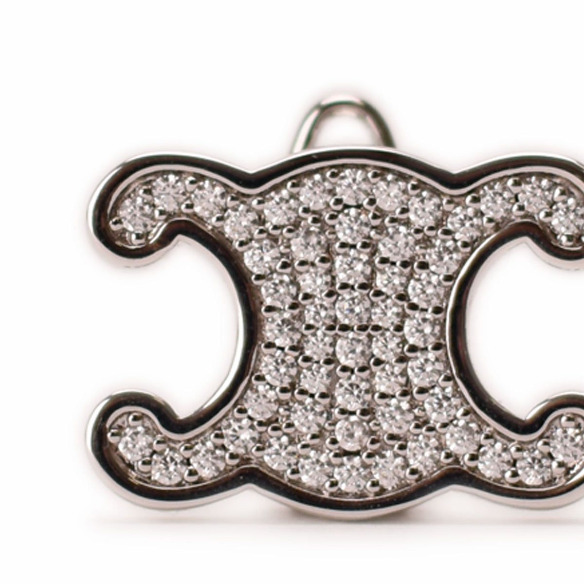 Silver-toned diamond-encrusted C-shaped pendant, curated Pre-loved Luxury by Myluxe in Helsinki.