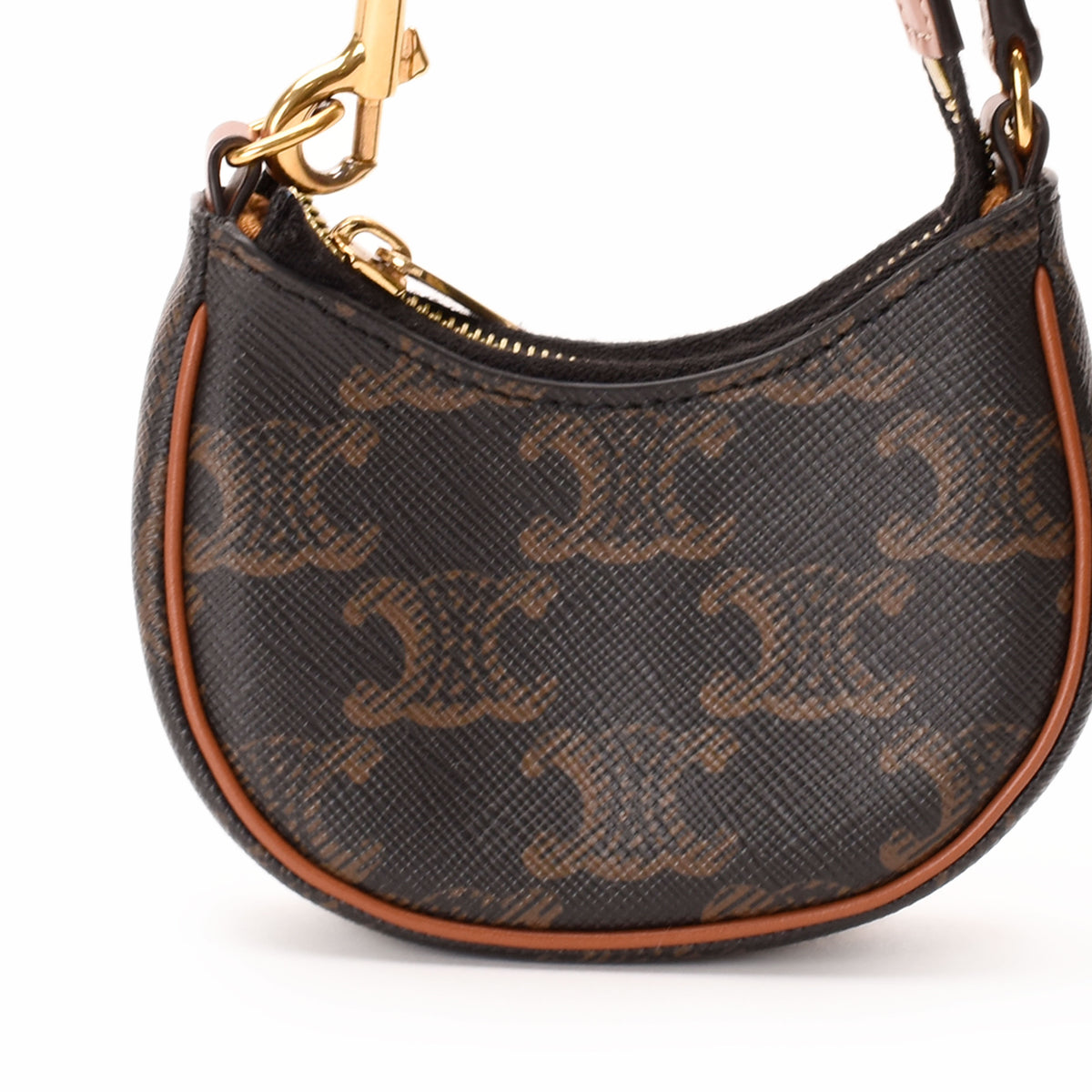 Celine monogram coated canvas crescent shoulder bag in brown and tan. curated Pre-loved Luxury by Myluxe in Helsinki.