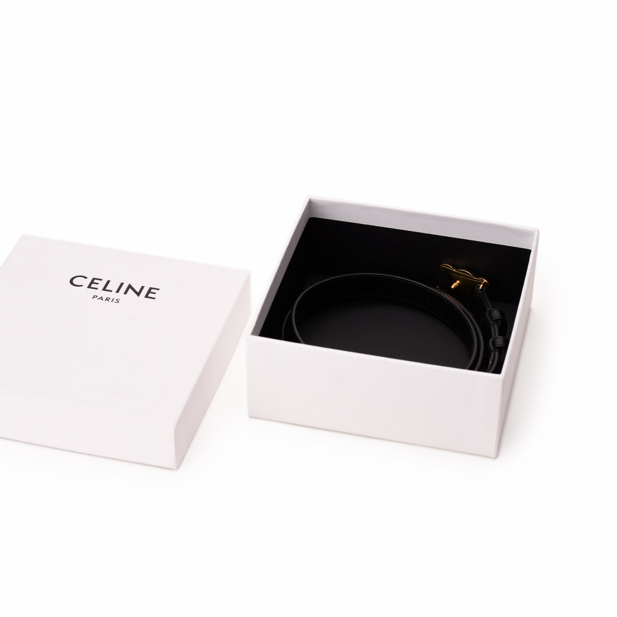 Celine black leather belt with gold-tone hardware in a signature box. curated Pre-loved Luxury by Myluxe in Helsinki.