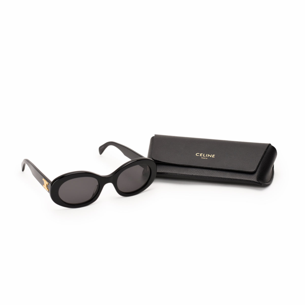 Black Celine oval sunglasses with gold logo detail, curated Pre-loved Luxury by Myluxe in Helsinki.