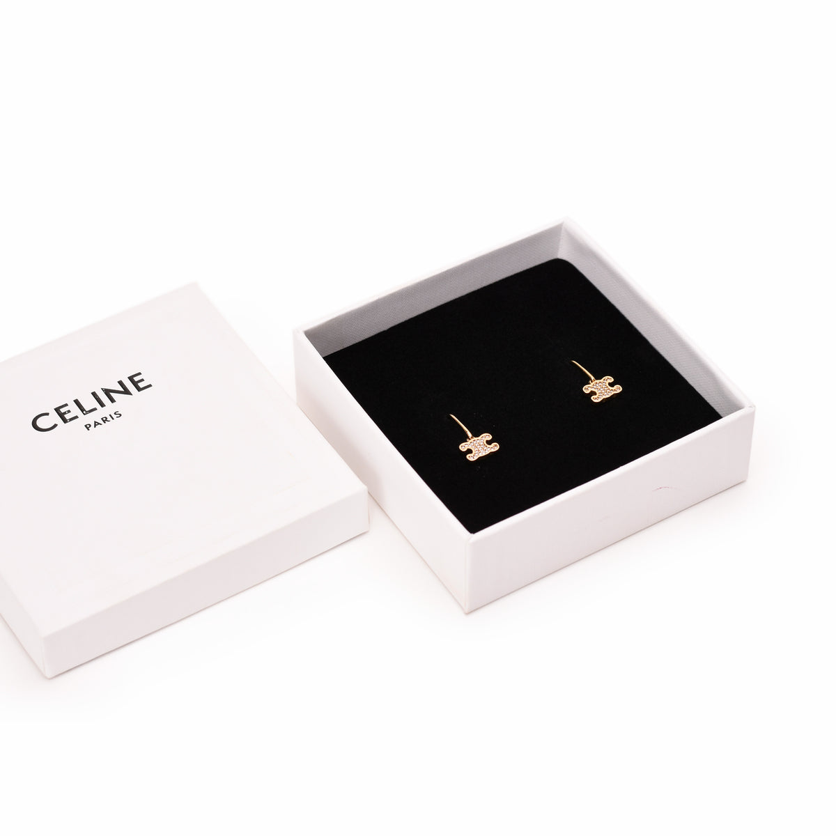 Gold-tone Celine Triomphe stud earrings in a luxury gift box. curated Pre-loved Luxury by Myluxe in Helsinki.