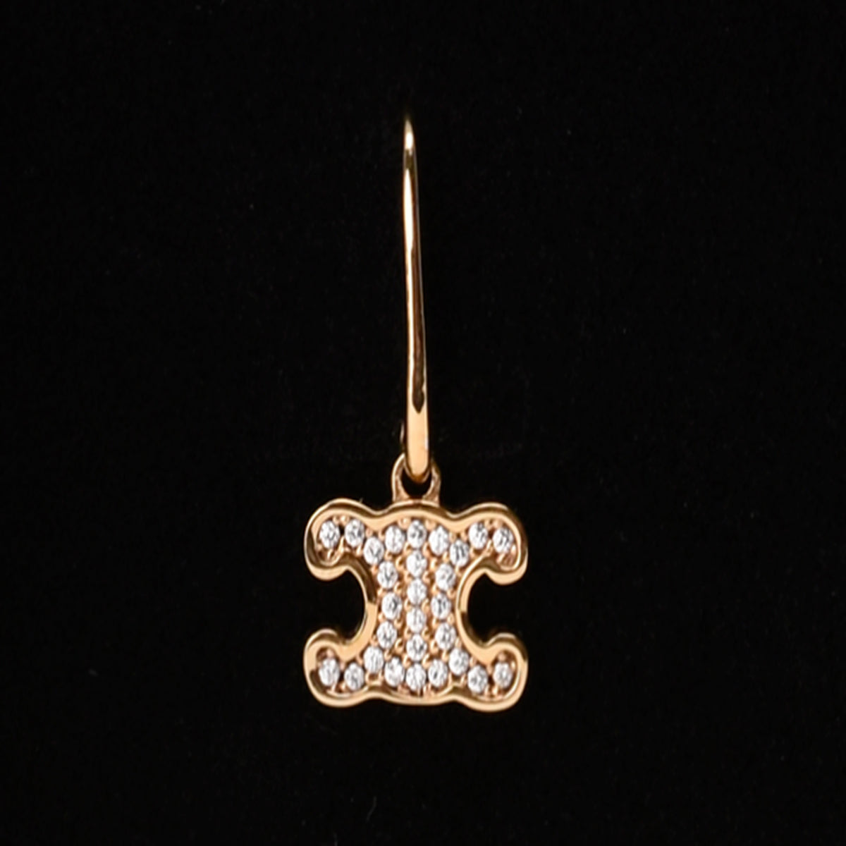 Gold Celine logo pendant encrusted with sparkling diamonds, curated Pre-loved Luxury by Myluxe in Helsinki.