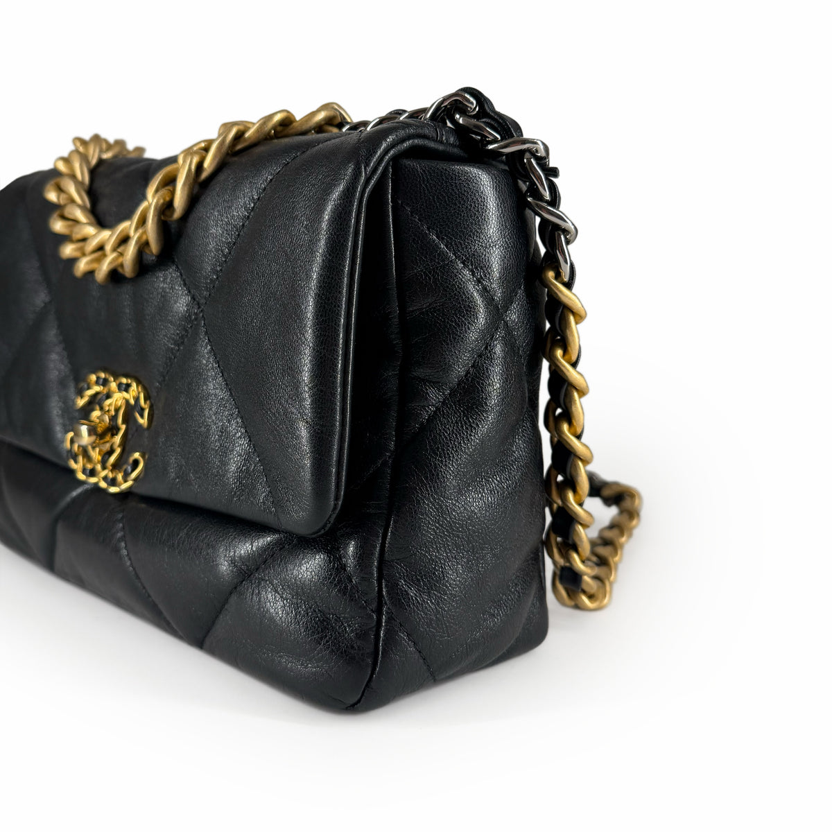 Black quilted leather Chanel handbag with gold-tone chain strap, curated Pre-loved Luxury by Myluxe in Helsinki.