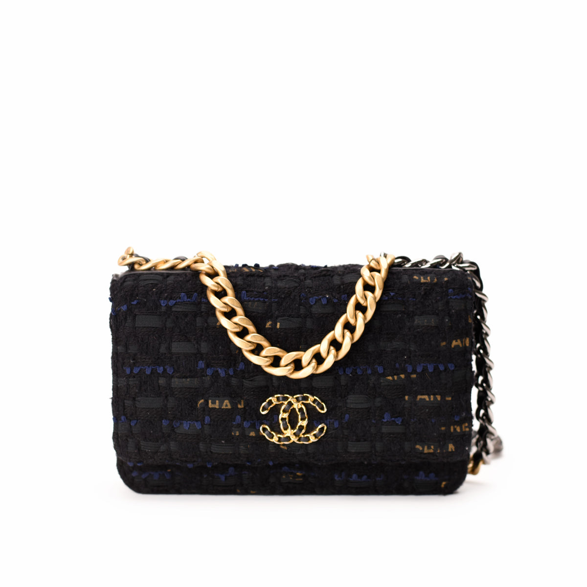 Black tweed Chanel flap bag with gold chain strap, curated Pre-loved Luxury by Myluxe in Helsinki.
