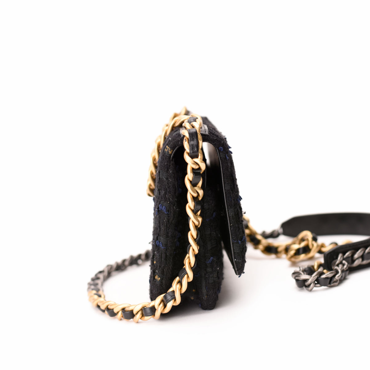 Black textured tweed flap bag with gold-tone chain strap, curated Pre-loved Luxury by Myluxe in Helsinki.