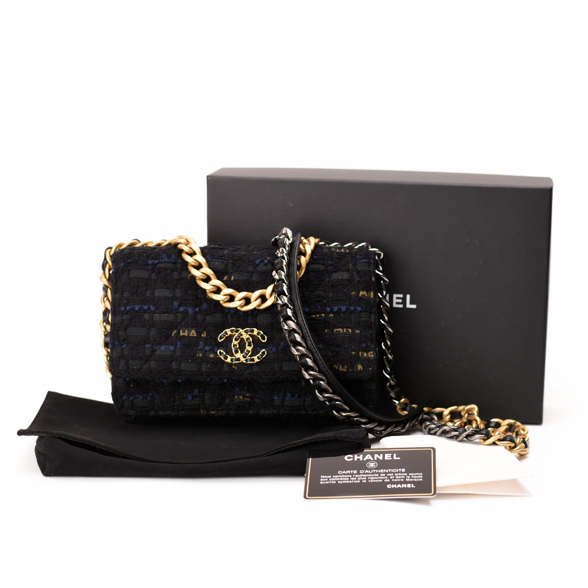 Black textured tweed Chanel flap bag with gold chain strap, curated Pre-loved Luxury by Myluxe in Helsinki.