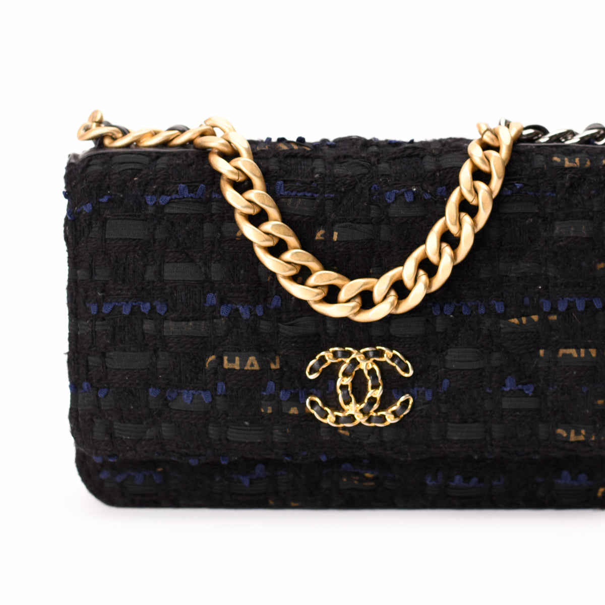 Chanel black tweed handbag with gold chain strap and logo, curated Pre-loved Luxury by Myluxe in Helsinki.