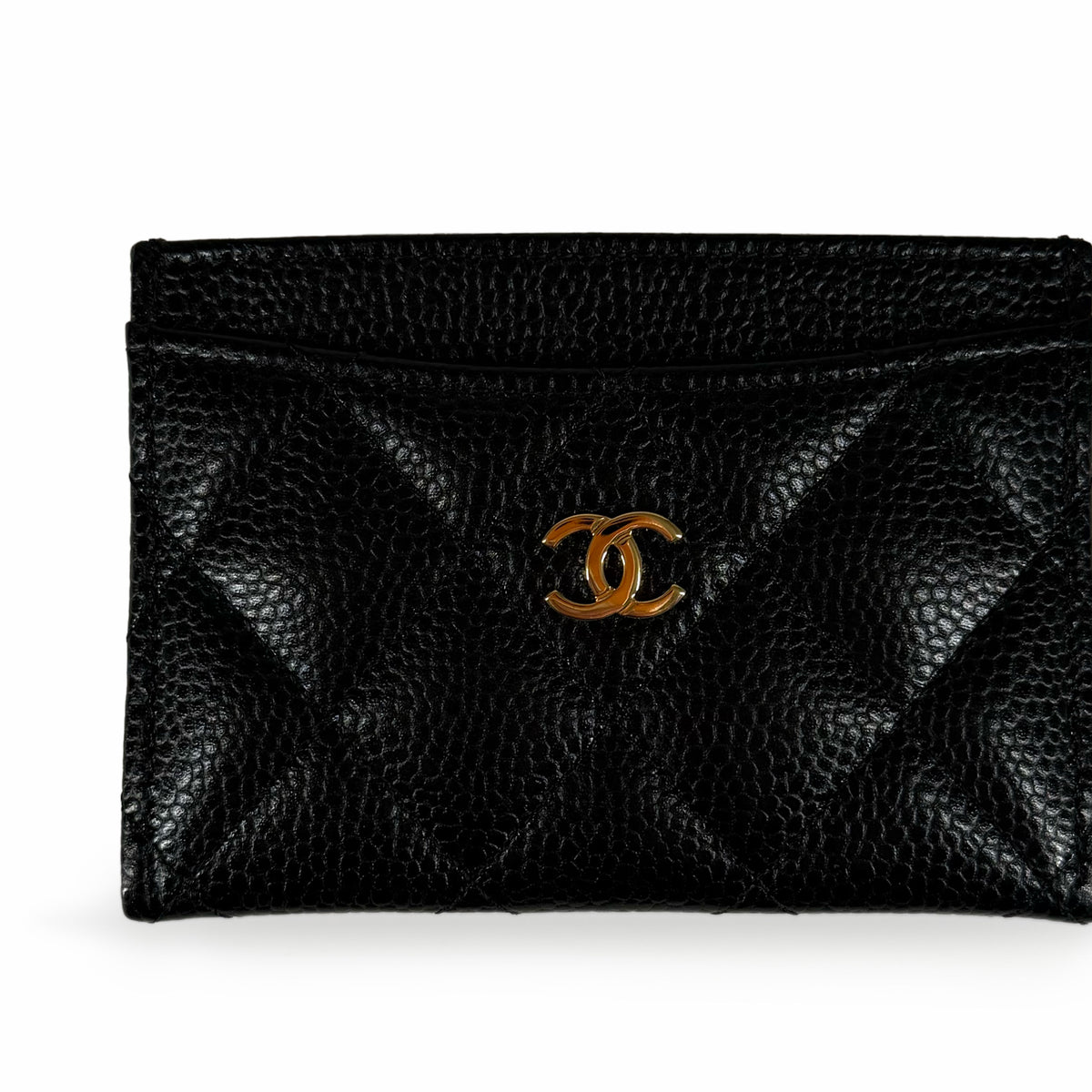 Black quilted caviar leather Chanel card holder with gold-tone interlocking CC logo, curated Pre-loved Luxury by Myluxe in Helsinki.