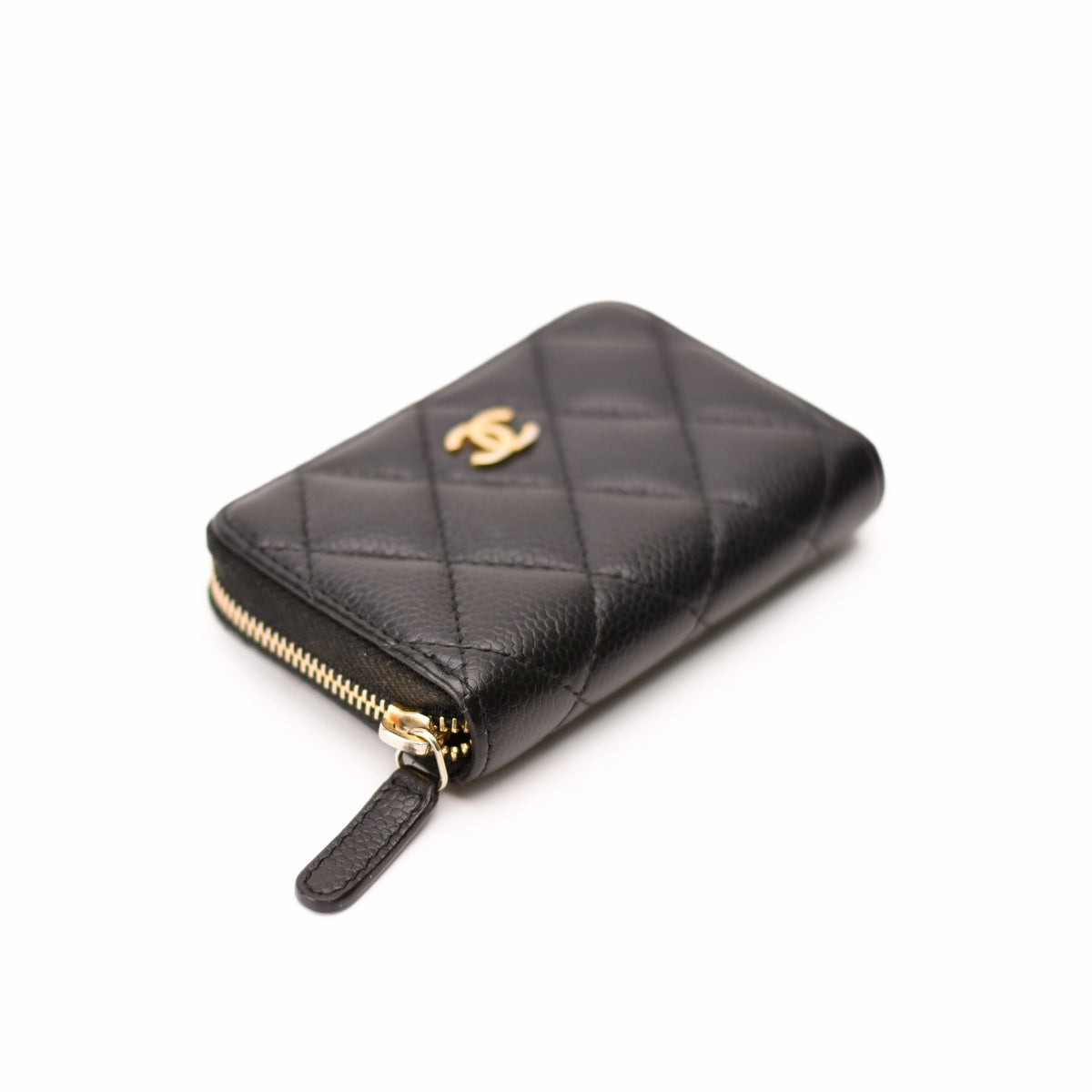 Black quilted lambskin Chanel zip-around wallet with gold hardware. curated Pre-loved Luxury by Myluxe in Helsinki.