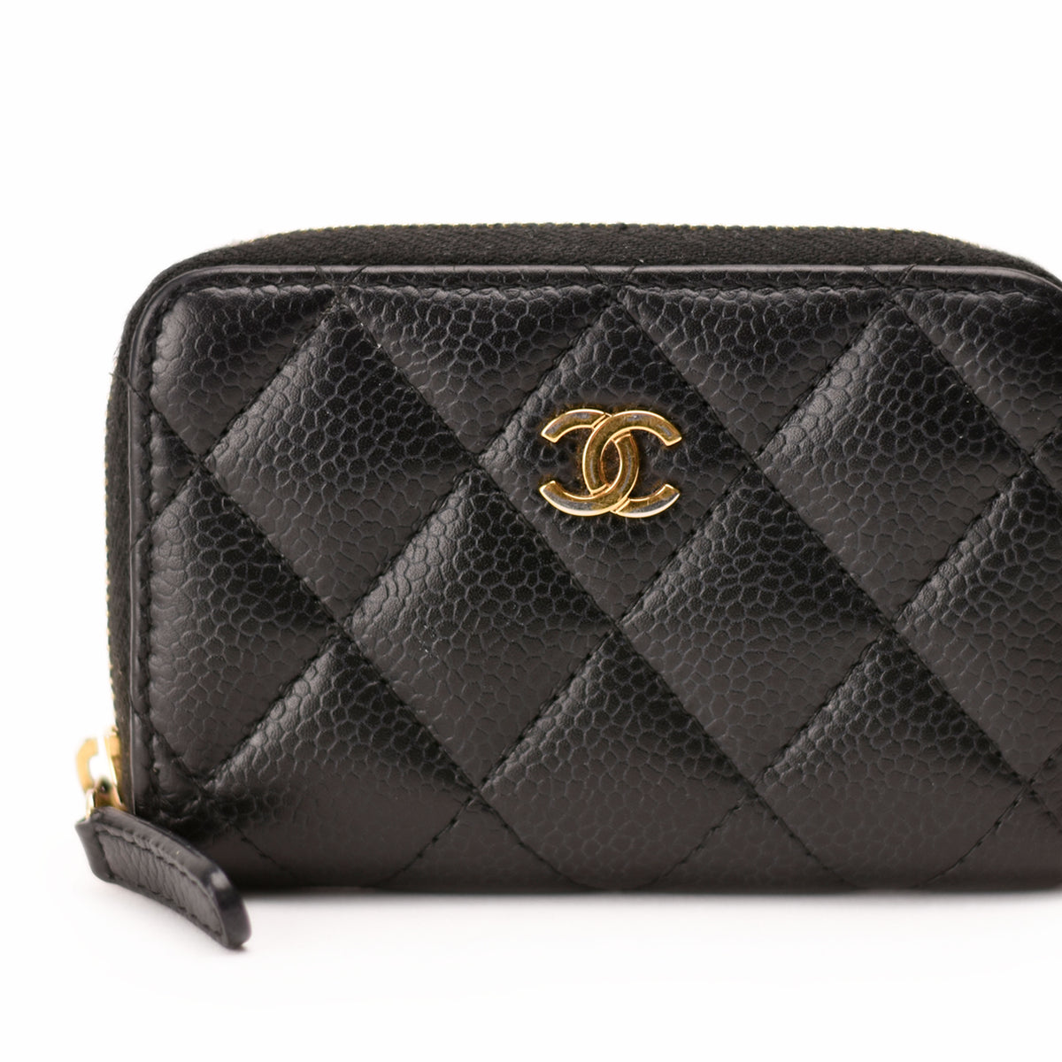 Black quilted caviar leather Chanel zip wallet with gold-tone logo. curated Pre-loved Luxury by Myluxe in Helsinki.