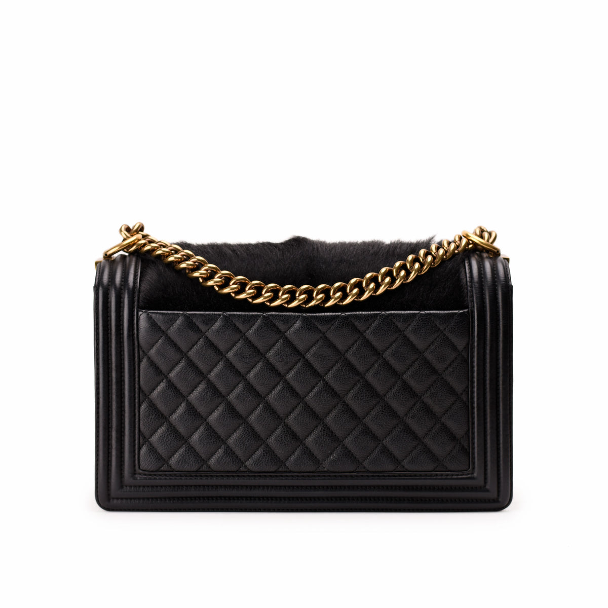 Black quilted leather handbag with gold chain strap, curated Pre-loved Luxury by Myluxe in Helsinki.
