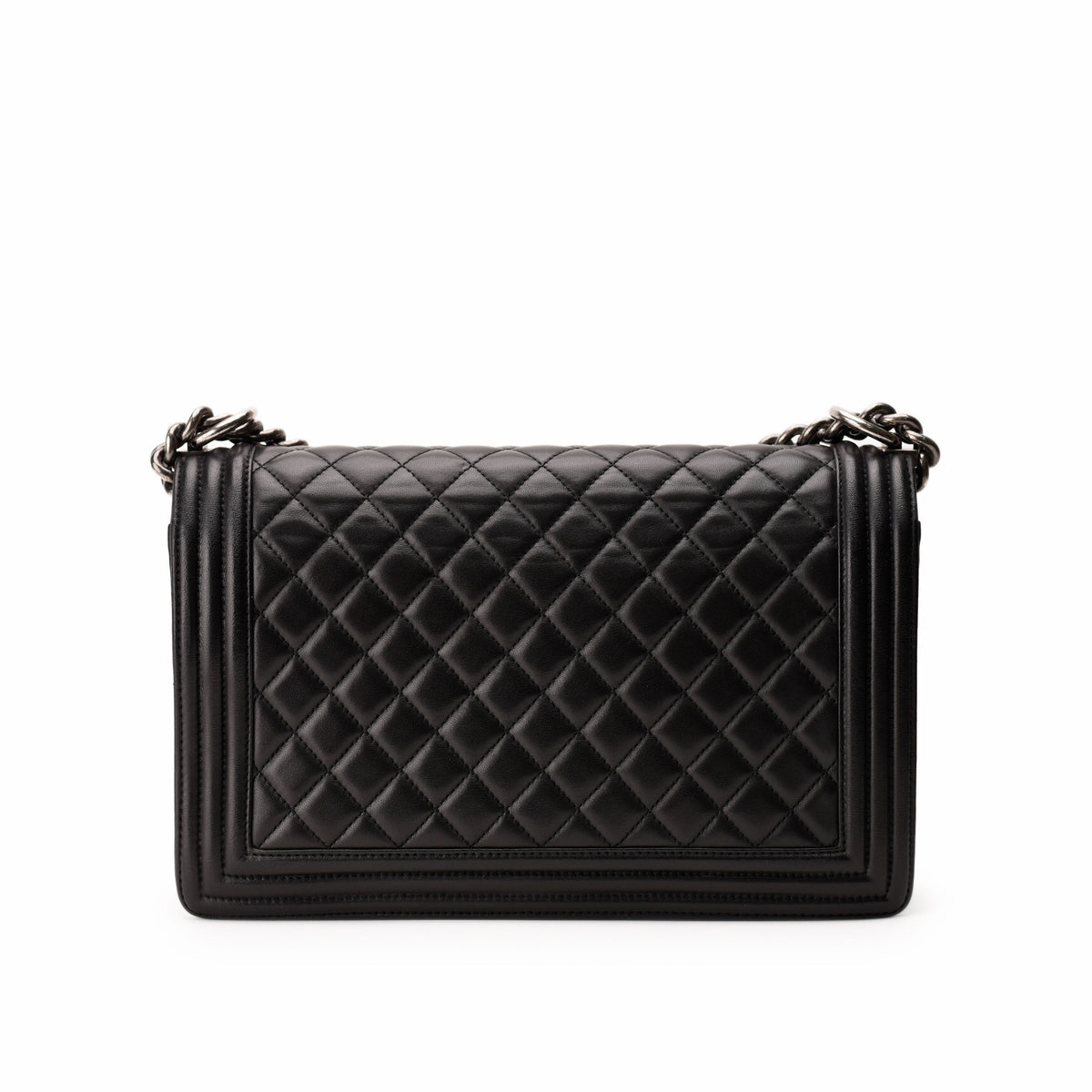Black quilted leather shoulder bag with silver chain strap, curated Pre-loved Luxury by Myluxe in Helsinki.