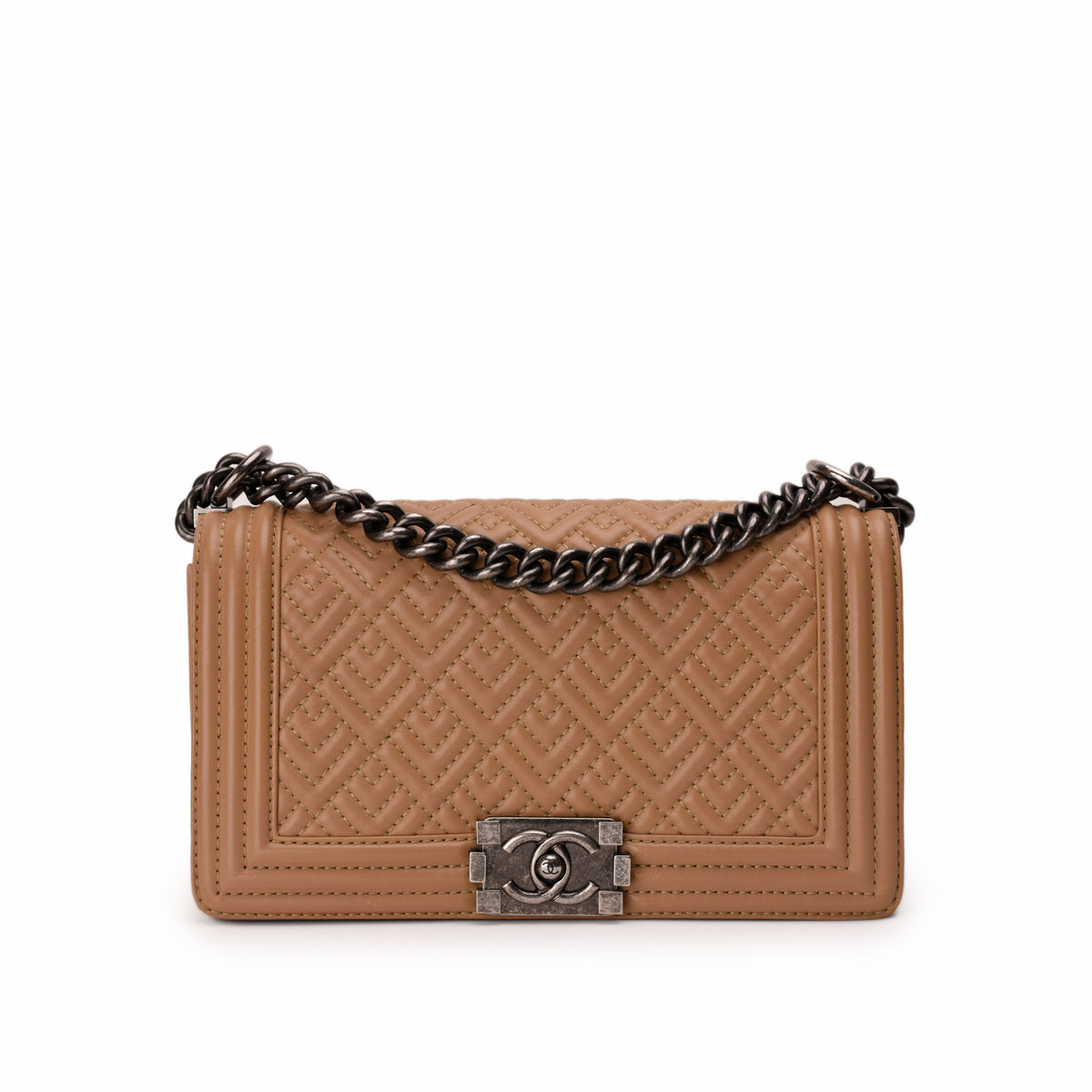 Tan quilted leather Chanel flap bag with silver chain strap, curated Pre-loved Luxury by Myluxe in Helsinki.