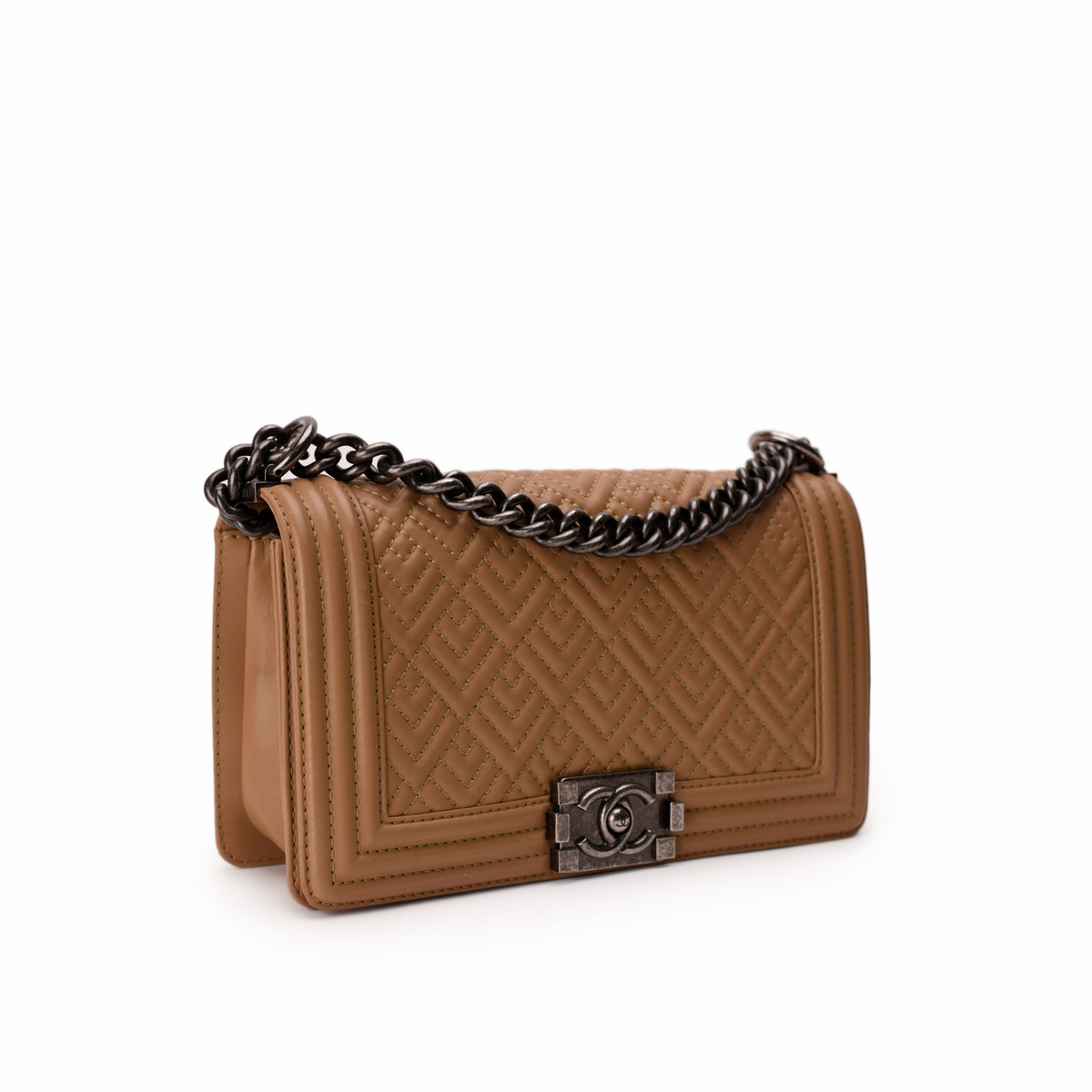 Tan quilted leather Chanel flap bag with silver chain strap, curated Pre-loved Luxury by Myluxe in Helsinki.