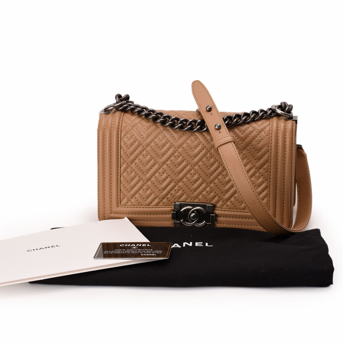 Tan quilted leather Chanel handbag with silver chain strap, curated Pre-loved Luxury by Myluxe in Helsinki.