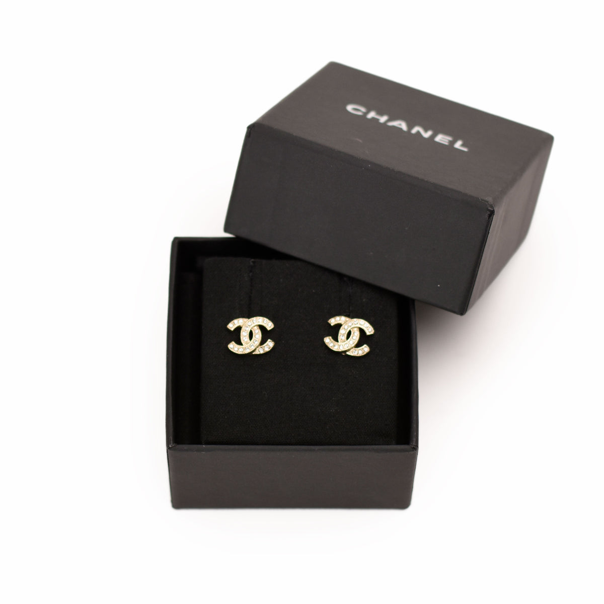 Chanel gold-tone CC logo stud earrings with crystal embellishments. curated Pre-loved Luxury by Myluxe in Helsinki.