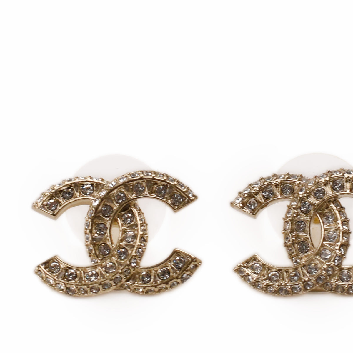 Gold-tone Chanel double C logo earrings encrusted with shimmering crystals, curated Pre-loved Luxury by Myluxe in Helsinki.