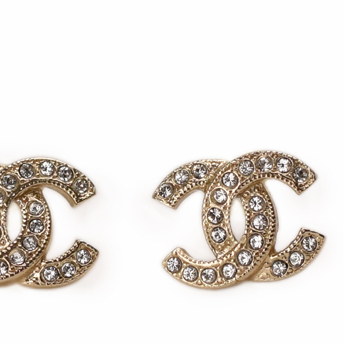 Gold-tone Chanel interlocking CC earrings encrusted with sparkling crystals. curated Pre-loved Luxury by Myluxe in Helsinki.