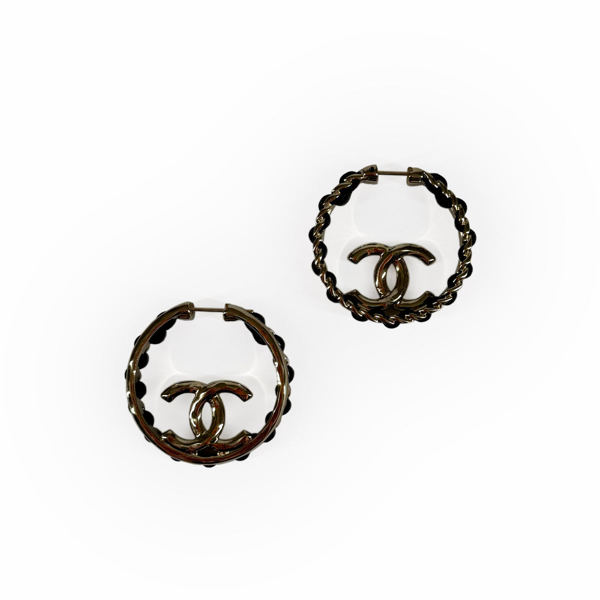 Gold-tone Chanel hoop earrings with iconic interlocking CC logo, curated Pre-loved Luxury by Myluxe in Helsinki.