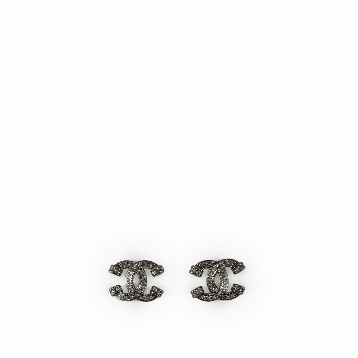 Silver-tone Chanel interlocking CC stud earrings with crystal embellishments, curated Pre-loved Luxury by Myluxe in Helsinki.